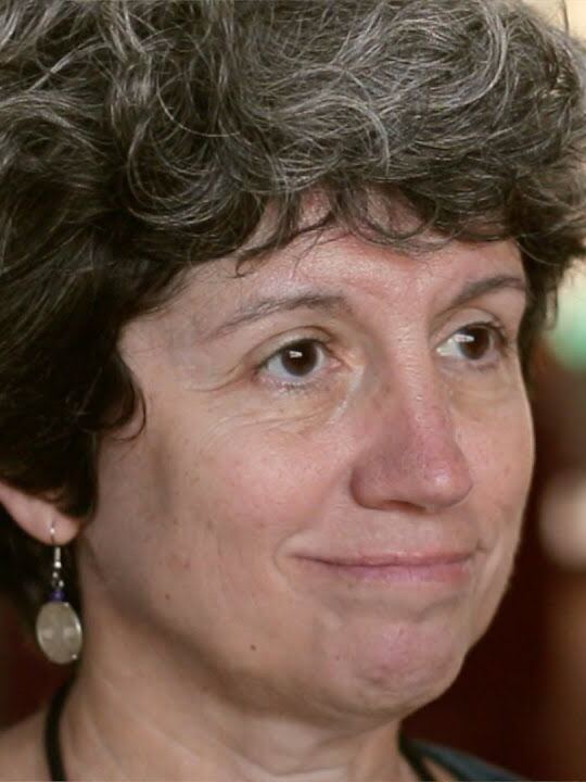 Jody Underwood, in profile, with short curly hair.